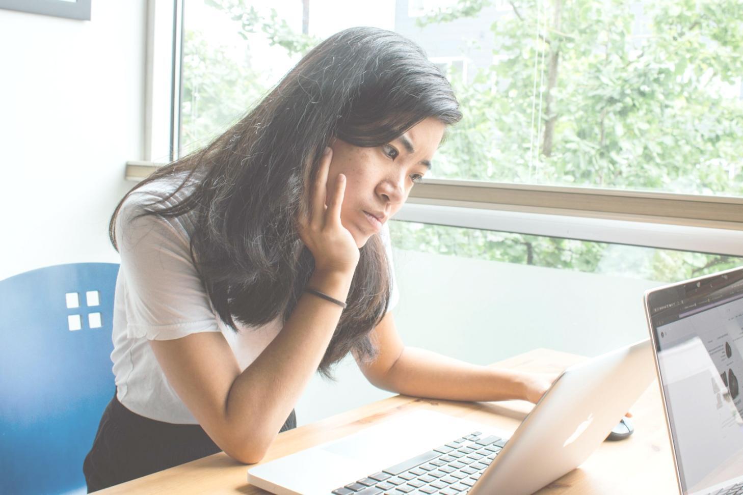 Developers collaborating on authentication code during workshop session